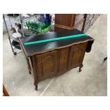 Cabinet with drop leafs