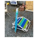 4 beach chairs and umbrella