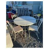 Rod iron glass top table with 4 chairs