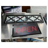 Coat rack and lighted sign