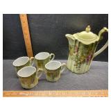 Tea pitcher and cups