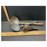 2 copper ladles and a funnel