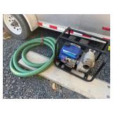 Portable gas water pump with hose.