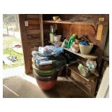 Contents of comer in shed. Flower pots, chemicals+