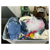 Tote with baby clothes and other