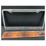 Metal Hendrick Imports Tag Cover.