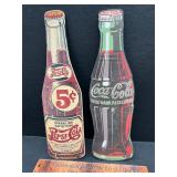 Cardboard Coke and Pepsi signs