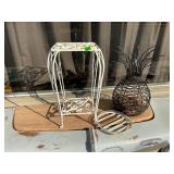 Iron plant stand and pineapple