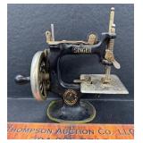 Antique miniature singer sewing machine. Works