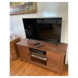 Vizio tv dvd player vhs cabinet and contents