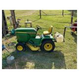 John Deere 210 mower with spray boom running
