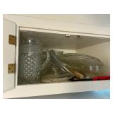 Contents of cabinet over fridge