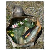 Vintage bottle and metal funnel