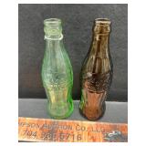 2 vintage Coke bottles