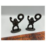 2 cast iron Michelin men