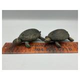 2 cast iron turtles