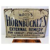 Early tin Hornbuckles remedy sign