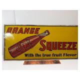 Early orange squeeze tin tacker sign embossed