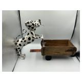 Metal dog pushing a wagon