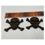 Cast iron skulls and crossbones