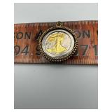Silver half dollar in bezel