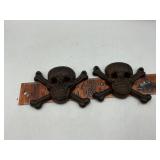 Cast iron skulls and crossbones