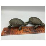2 cast iron turtles