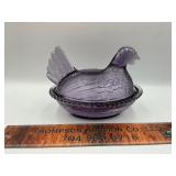 Purple hen on the nest