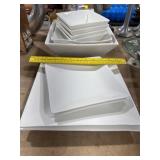 2 Stacks of White Dishes