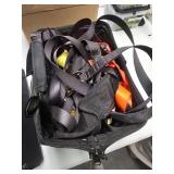 Black Bag Containing Assorted Straps and Fasteners