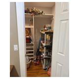 Contents of Closet Including Shelving Units and Mi