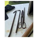 Tin snips. Pry bars, hand saw, nippers, tire iron