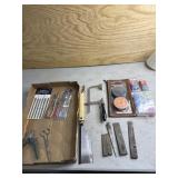 Brass wedges, wire connectors, coping saw, hand