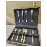 Gold colored flatware and box