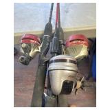 3 fishing poles with reels