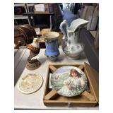 Face of the world plate, vase pitcher and eagle