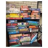 Lg lot of puzzles bring boxes