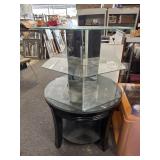 Round black table with glass and mirrored display