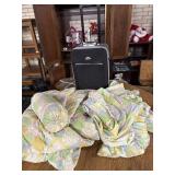 Quilt with matching sheets and pillows and suit