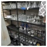 Large lot of glasses, stemware  & dishes bring