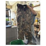 Tote of rain coats and hunting gears bid 2 xl