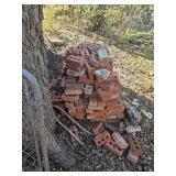Large pile of red brick you load
