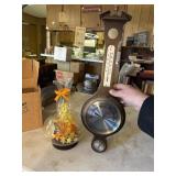 Barometer and flower arrangement