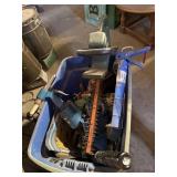Tote of tools, hedge trimmer caulk gun and more