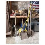 Shovels and post hole diggers and axes
