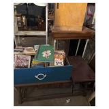 Drawer of books, coffee table, bed tray, leaves