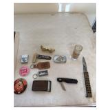 USSKitty Hawk lighter, belt buckles, knives and