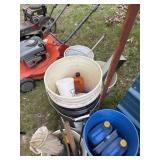 Several buckets with funnels, wood metal and more