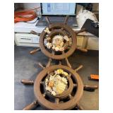 2 ship wheels with shells