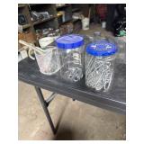 Bucket of screw fence staples. And more